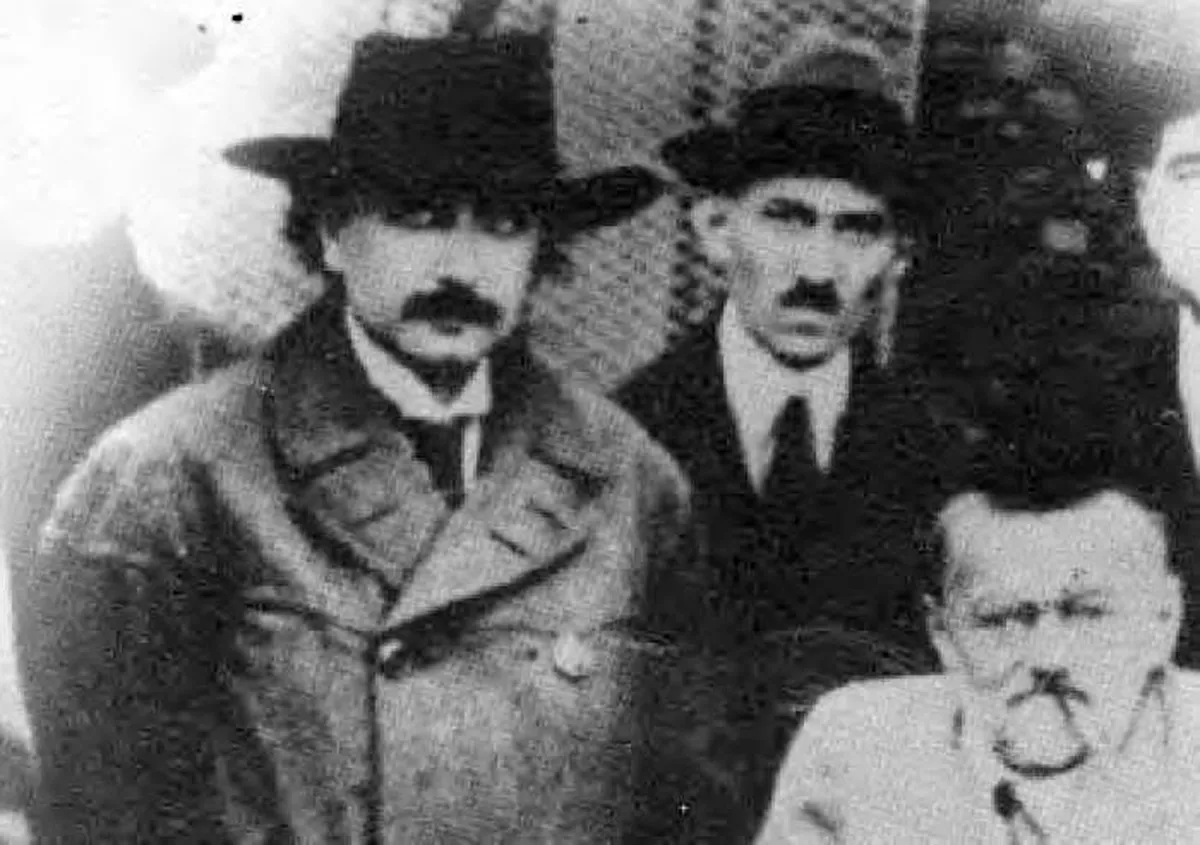 Historical photo of Nikola Tesla with colleagues
